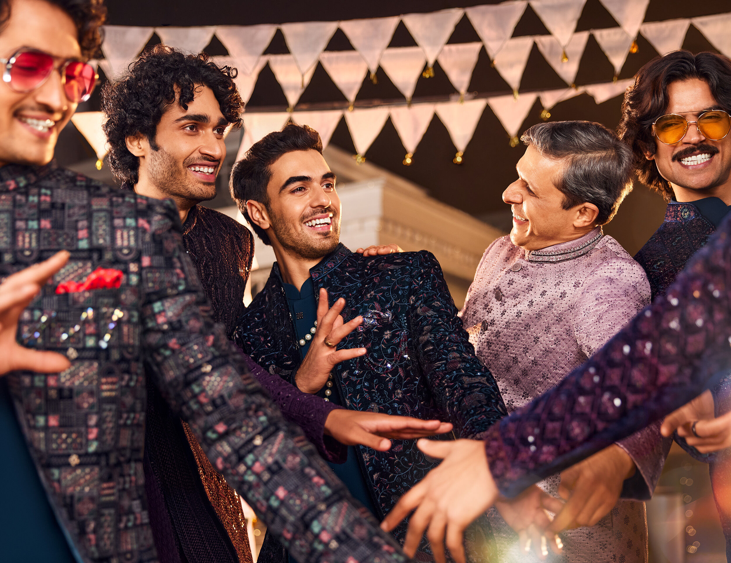 Mens enjoying and dancing in wedding wearing chikenkari kurtas for wedding day 